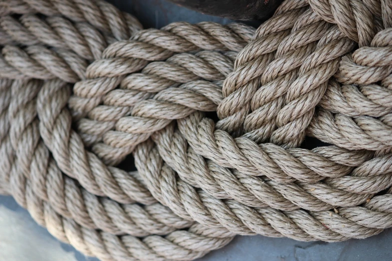 a pile of rope sitting on top of a metal container, symmetrical detail, high res photo, high details photo