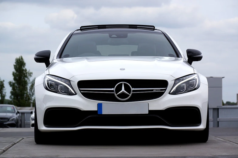 a white mercedes parked in a parking lot, pexels, transparent black windshield, front flash, very sharp and detailed image, animation