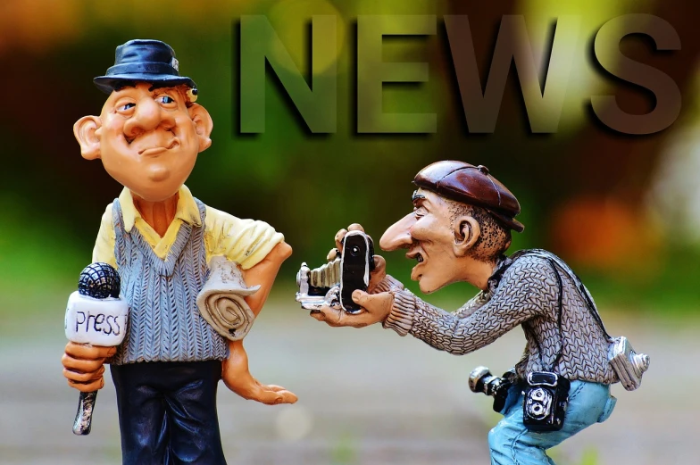 a couple of figurines standing next to each other, a picture, by Radi Nedelchev, trending on pixabay, journalist photo, toy advertisement, header text”, camera photo