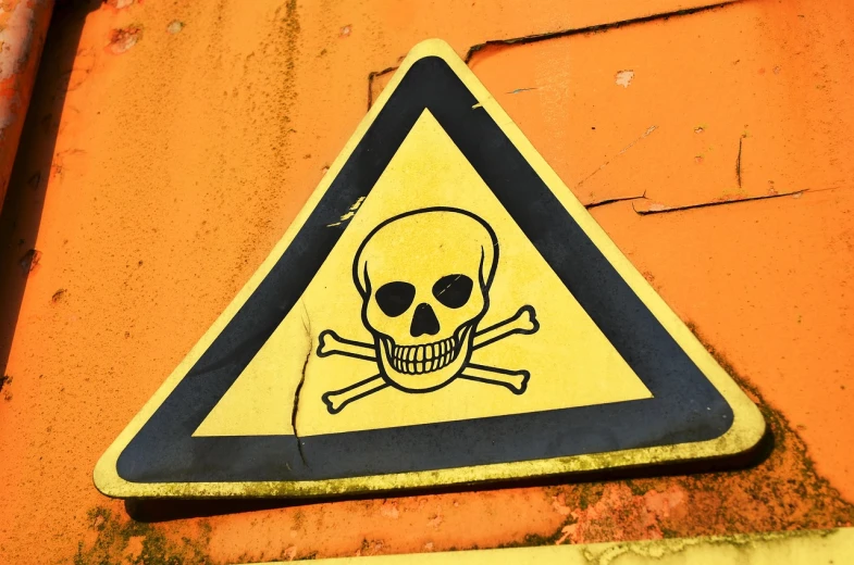 a yellow and black sign with a skull on it, by Richard Carline, pixabay, graffiti, dangerous chemical hazards, deadly drone, istockphoto, cone