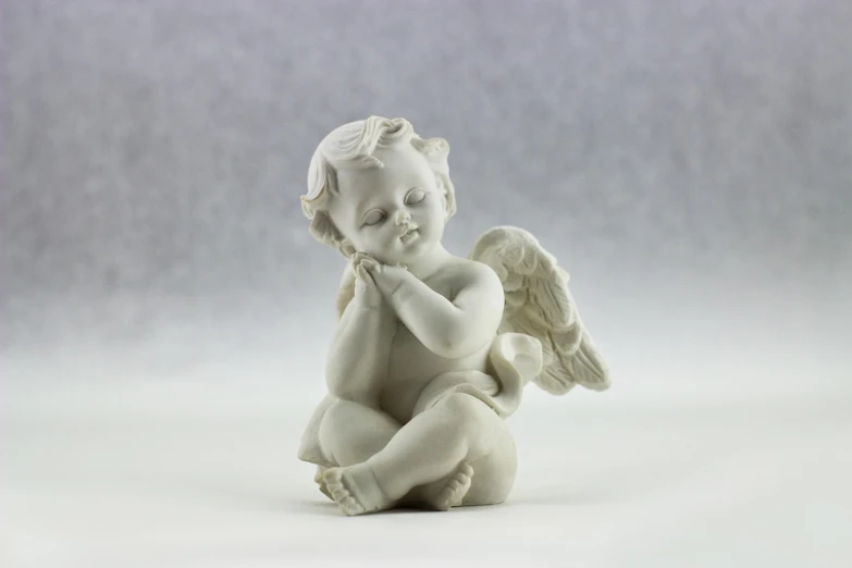 a statue of an angel sitting on the ground, a marble sculpture, baroque, miniature product photo, smooth shading, product introduction photo, kid