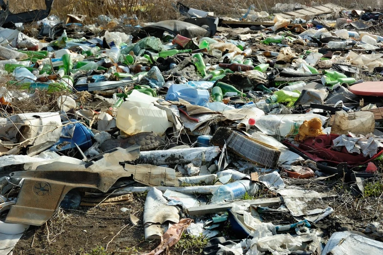 a pile of trash sitting on the side of a road, a photo, by Aleksander Gierymski, shutterstock, plasticien, 2 0 1 0 photo, bottles, broken toilets, high quality photo