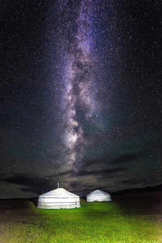 a couple of white tents sitting on top of a lush green field, by Dietmar Damerau, light and space, spectacular milky way, mongolia, beijing, twins