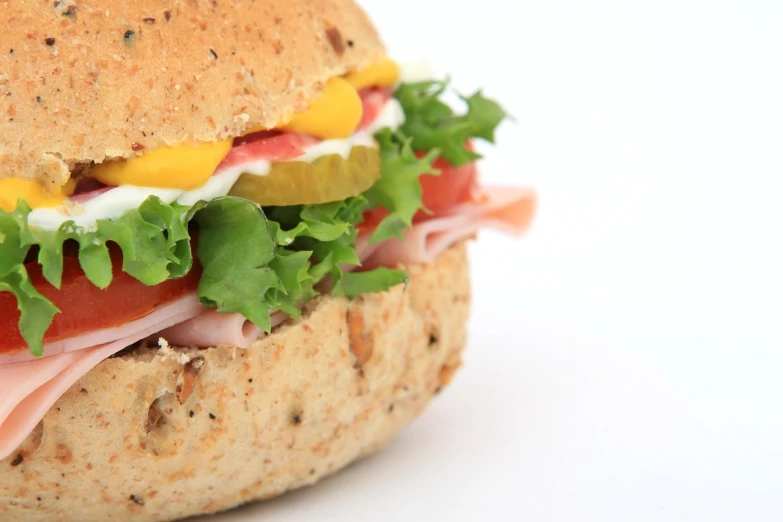 a ham and cheese sandwich with lettuce and tomatoes, pexels, bauhaus, istockphoto, bun, mango, closeup - view