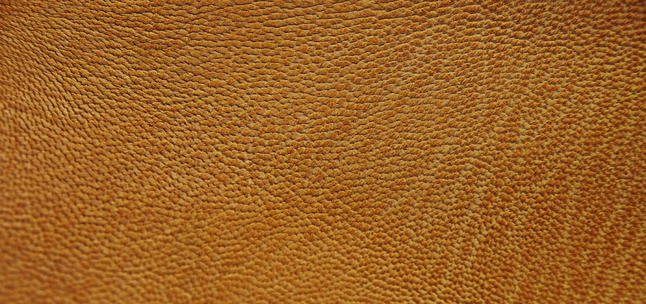 a close up of a brown leather surface, a macro photograph, sōsaku hanga, iphone wallpaper, grain”