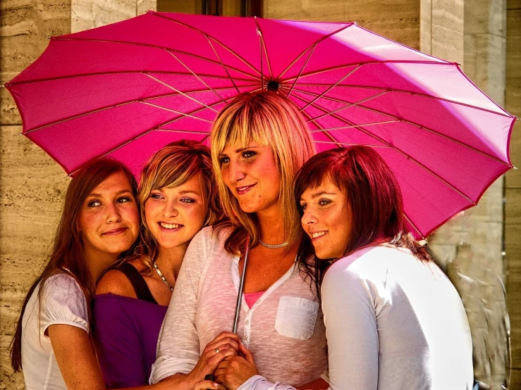 a group of women standing next to each other under a pink umbrella, a photo, by Thomas Häfner, pixabay, blonde hair with pink highlights, family portrait, teenage girl, stock photo