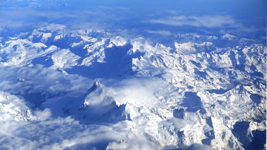 a view of snow covered mountains from an airplane, by Erwin Bowien, 7 7 7 7, detalied, teaser, thumbnail