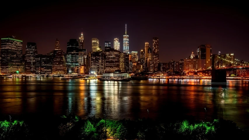 a view of a city at night from across the water, by Joseph Pisani, pexels, brooklyn, usa-sep 20, hdr photo, closeup view