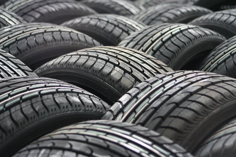 a bunch of tires stacked on top of each other, a stock photo, renaissance, jdm, packshot, seventies, reuters