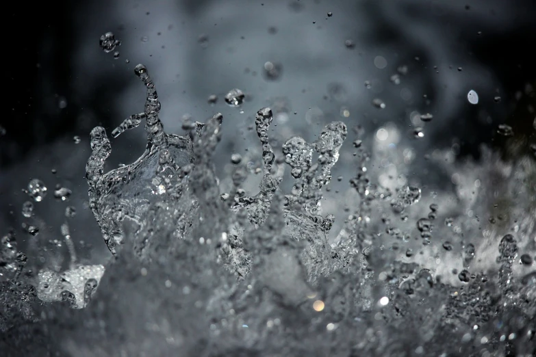 a fire hydrant spewing water into the air, a macro photograph, by Steven Belledin, pexels, digital art, paddle of water, black-water-background, crystal particles, wavy water