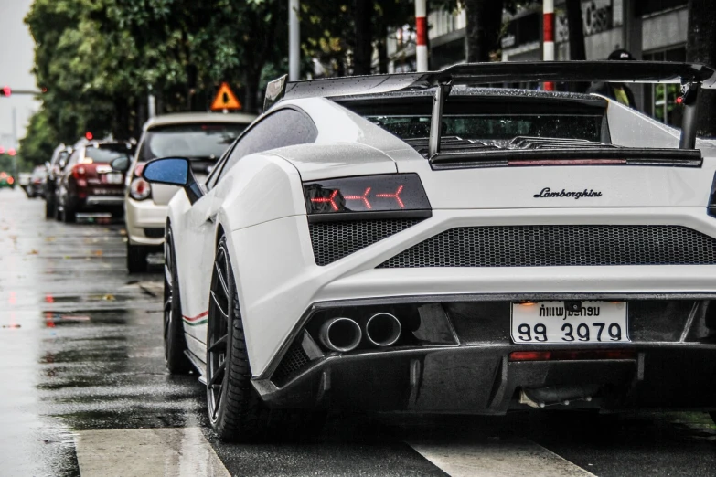 a white sports car parked on the side of the road, a photo, tumblr, lamborghini, bangkok, insanely detail, rear view