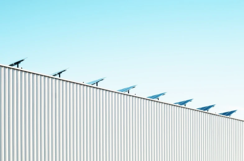 a row of solar panels on the side of a building, postminimalism, warehouses, untitled, fencing, top