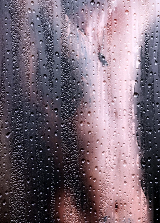 a close up of a person through a rain covered window, a stock photo, by Jan Rustem, lyrical abstraction, covered in pink flesh, dripping black iridescent liquid, under a shower, 4 k detail