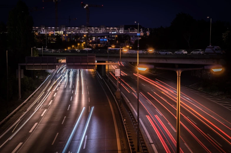 a city street filled with lots of traffic at night, a picture, by Thomas Häfner, freeway, photo taken in 2018, energy trails, taken with canon 8 0 d