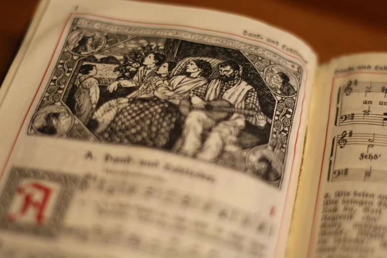 an open book sitting on top of a wooden table, a woodcut, arts and crafts movement, focus on the musicians, religious imagery, kodak photo, full of details