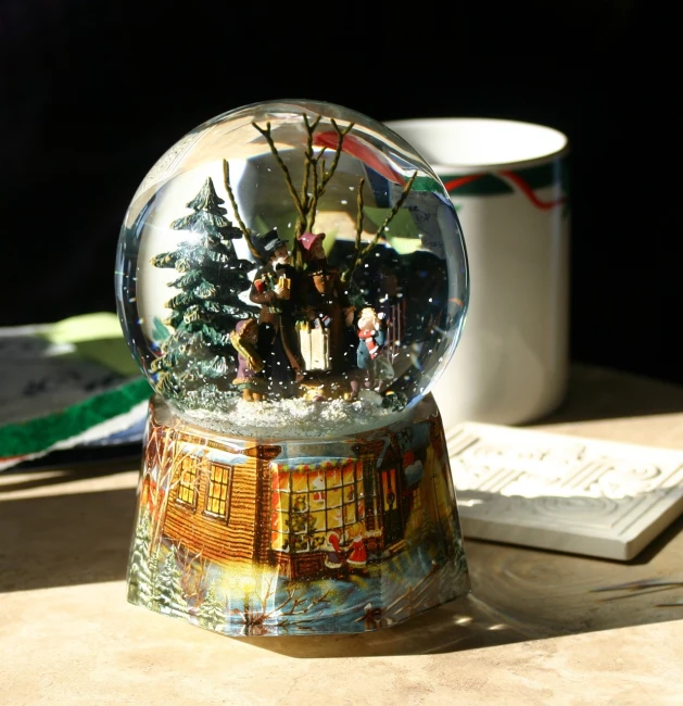 a snow globe sitting on top of a wooden table, a photorealistic painting, inspired by Thomas Kinkade, flickr, angled shot, toy photo, elves house, shot on kodak vision 200t