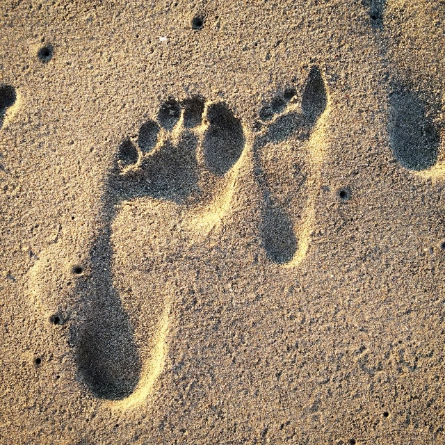 a close up of a person's footprints in the sand, pregnancy, rule of third!!!!, in the early morning, lowres