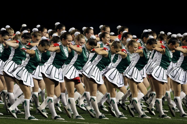 a group of women standing on top of a field, antipodeans, avant designer uniform, green and white, high school girls, rhythmic