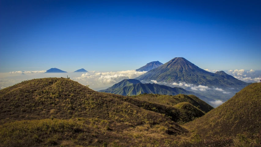 a group of people standing on top of a mountain, a photo, by Juan O'Gorman, shutterstock, sumatraism, volcano background, avatar image, high detailed photo, actors