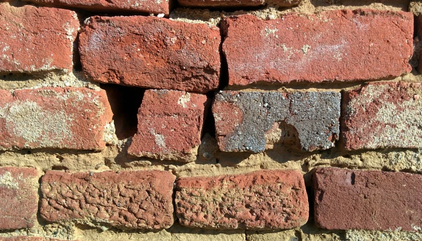a close up of a brick wall with a hole in it, by Jan Rustem, precisionism, reds, bluestone walls, cottage close up, bumps
