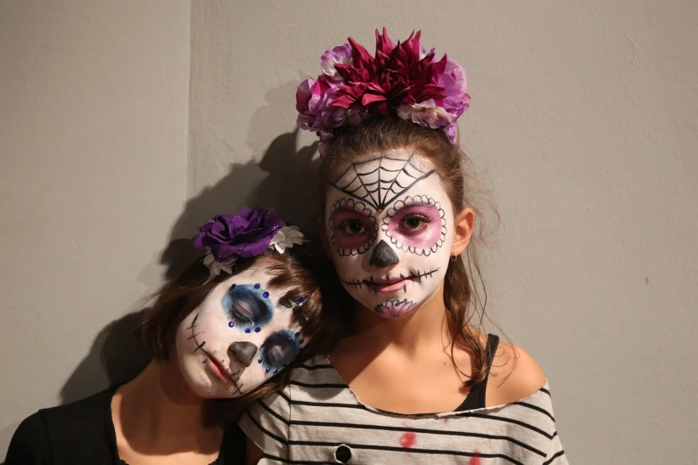 a couple of young girls standing next to each other, a portrait, by Verónica Ruiz de Velasco, flickr, vanitas, face paint, photo taken in 2018, vine, 1840580735