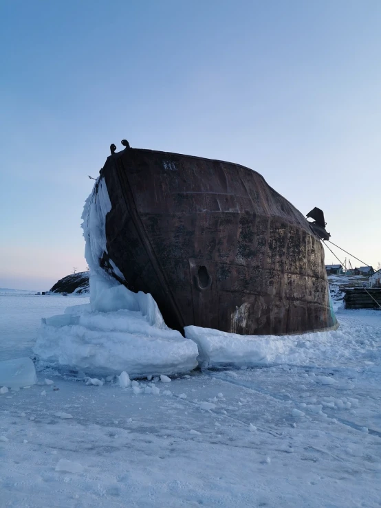 a boat that is sitting in the snow, a picture, new sculpture, in a nuclear submarine, mongolia, break of dawn on neptun, photo taken in 2018