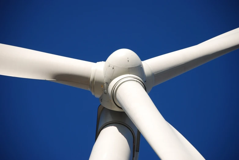 a close up of a wind turbine with a blue sky in the background, wikimedia commons, [ [ hyperrealistic ] ], random detail, version 3