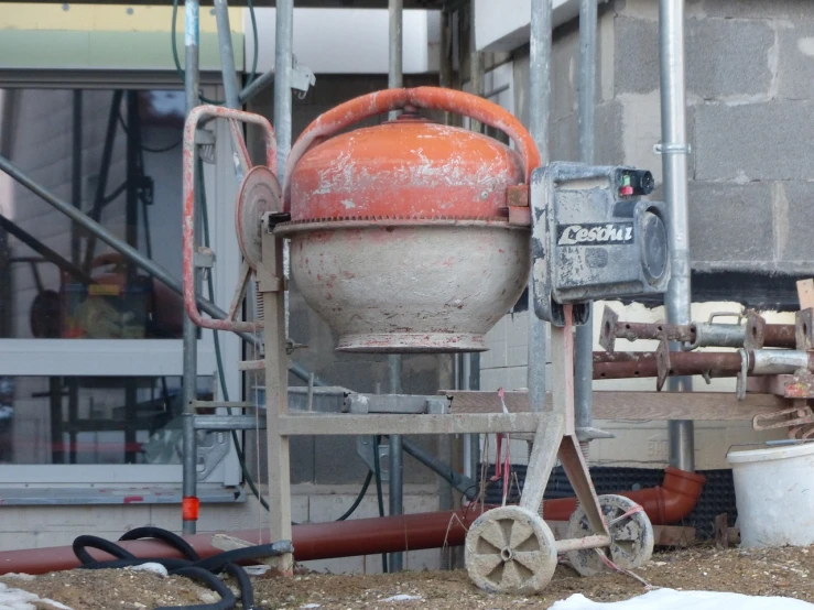 a cement mixer sitting on top of a pile of dirt, by Clément Serveau, flickr, bauhaus, bubbling cauldron!, machinery and wires, smooth concrete, detiled