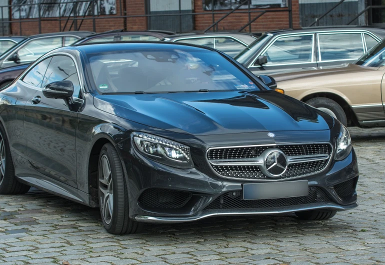 a black mercedes parked in a parking lot, a portrait, by Alexander Fedosav, pixabay, curved body, front flash, very clear image, no gradients