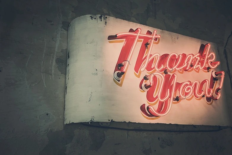 a neon sign hanging from the side of a building, by Ivan Trush, pixabay, thank you very much, vintage closeup photograph, thank you, hand painted style