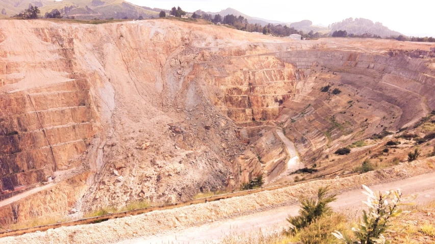 a view of a quarry from the top of a hill, a photo, by Alejandro Obregón, renaissance, many golden layers, catalog photo, deteriorated, 8 0 mm photo