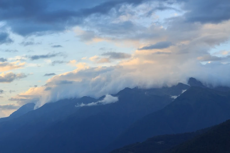 there is a plane that is flying in the sky, a picture, flickr, sichuan, storm in the evening, mount olympus, among heavenly sunlit clouds