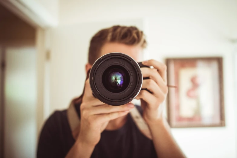 a man taking a picture with a camera, a picture, by Matthias Weischer, unsplash, art photography, closeup headshot, home photography portrait, avatar image, well lit professional photo