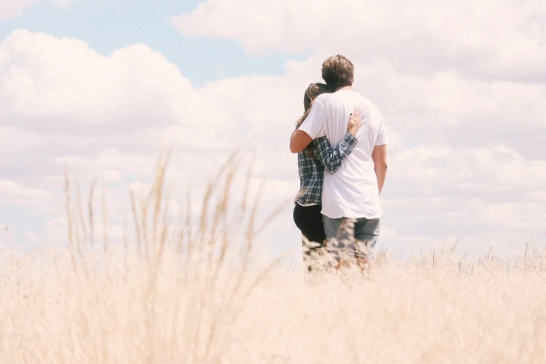 a man and a woman standing in a field, pexels, romanticism, hug, portra 4 0 0, featured, 2d