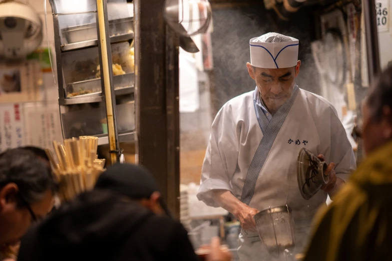 a man in a chef's hat cooking food in a kitchen, inspired by Shōzaburō Watanabe, in the streets of tokyo, still photo, banner, masamune shiro