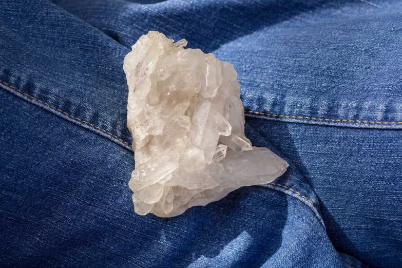 a rock in the back pocket of a pair of jeans, a macro photograph, crystal cubism, casual white garment, productphoto, crystalline translucent hair, product introduction photo