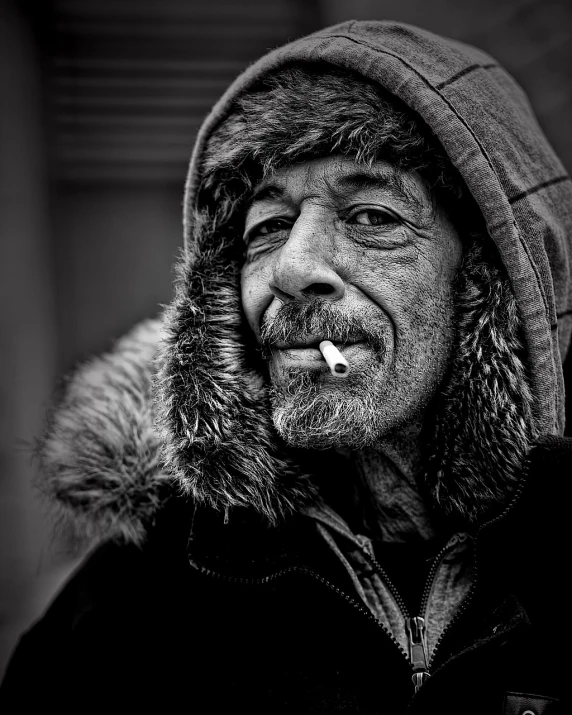 a black and white photo of a man smoking a cigarette, inspired by Lee Jeffries, trending on pixabay, donald trump as a homeless man, toronto, monochrome hdr, cold winter