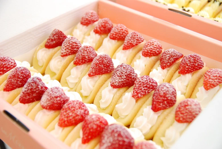 a close up of a box of food with strawberries, rasquache, cute bakery shop, kakejiku, foodphoto, in a row