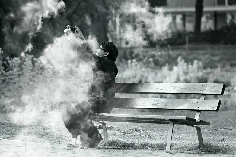 a black and white photo of a person sitting on a bench, a picture, surrealism, :6 smoke grenades, asian man, at the park, very accurate photo