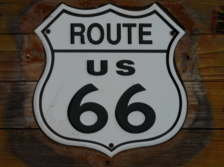 a route 66 sign on a wooden wall, flickr, front photo, foto, 600mm, rv