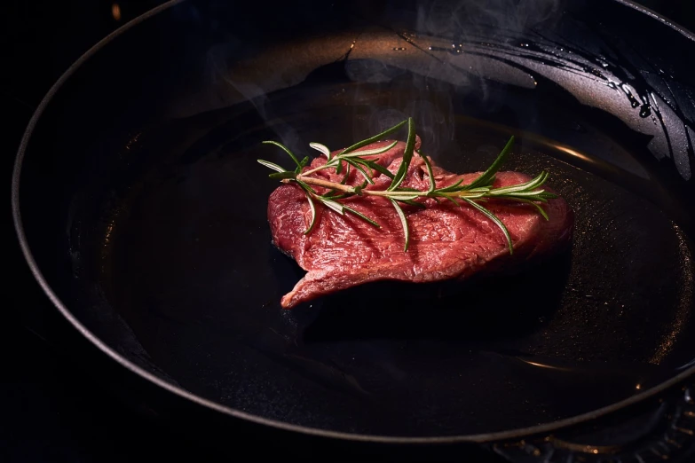 a steak in a frying pan with a sprig of rosemary, a stock photo, by Jakob Gauermann, shutterstock, renaissance, realistic cinematic shot, modern very sharp photo, 4 k product photo, an ultrafine detailed photo