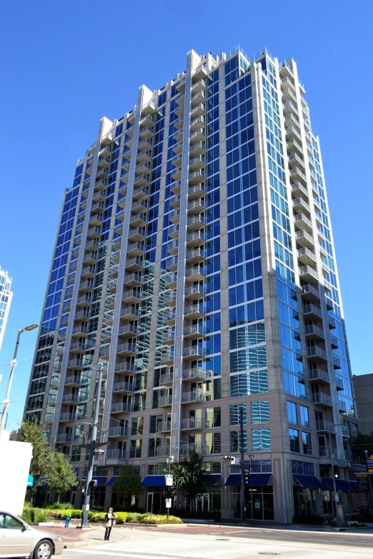 a very tall building with a lot of windows, by Paul Mavrides, flickr, myrtle, view from across the street, sapphire, listing image