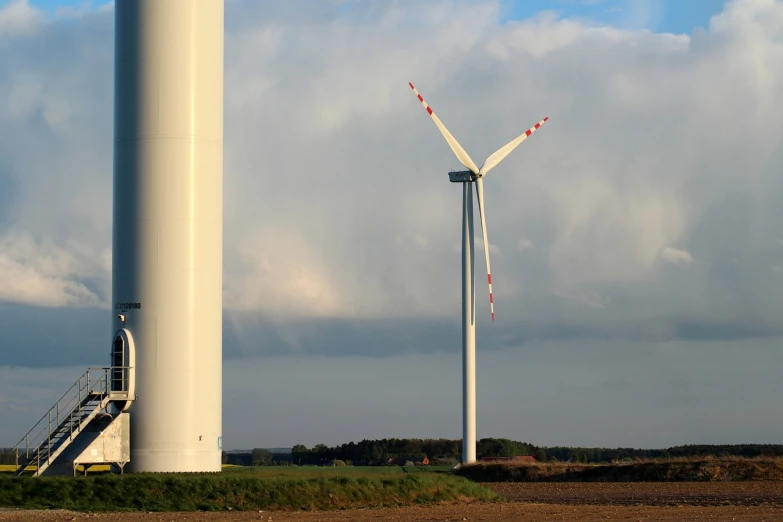 a couple of wind turbines sitting next to each other, by Werner Gutzeit, shutterstock, ultrawide lens”, taken with a pentax k1000, jean-sebastien rossbach, eldenring