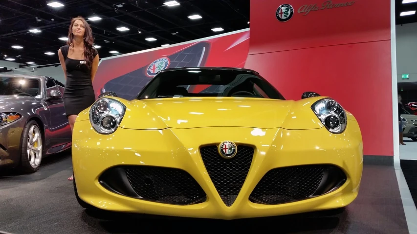 a woman standing next to a yellow sports car, a picture, by Matt Cavotta, renaissance, 2015 alfa romeo 4c, photo taken with an iphone, with cool headlights, nicely detailed