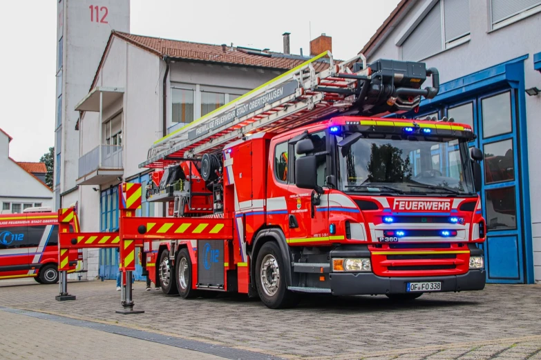a red fire truck parked in front of a building, a photo, by Thomas Häfner, shutterstock, lower saxony, ultra wide-shot, fire dragon, 6 4 0