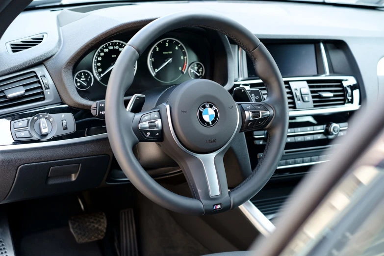 a close up of a steering wheel in a car, a picture, by Thomas Häfner, shutterstock, bmw, packshot, high detail photo, modern setting