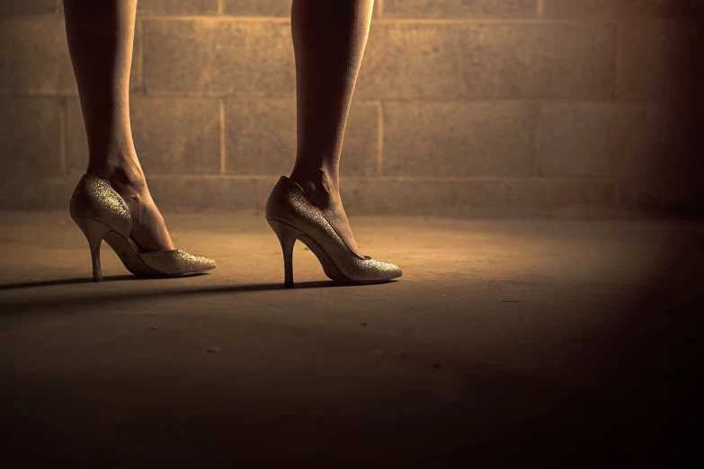 a close up of a person wearing high heels, a portrait, by Matt Stewart, shutterstock, renaissance, lighting on concrete, vintage glow, performance, stock photo