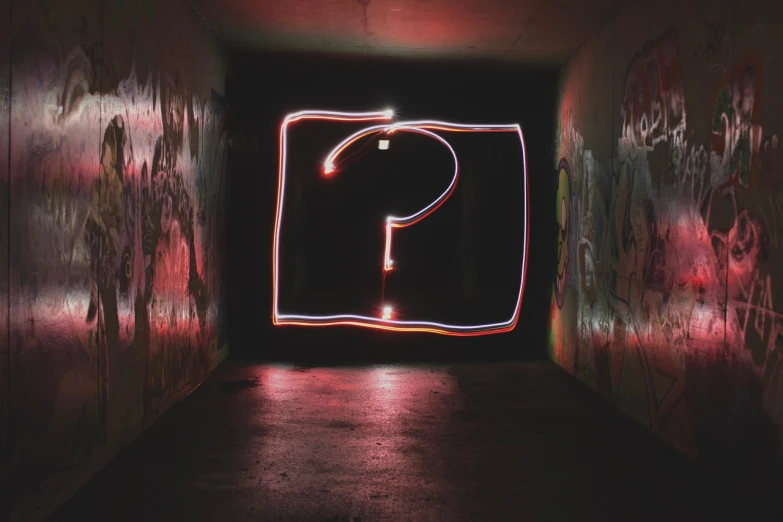 a light painting of a question mark on a wall, a picture, pexels, graffiti, istockphoto, red neon lights inside it, inquisitive, where a large