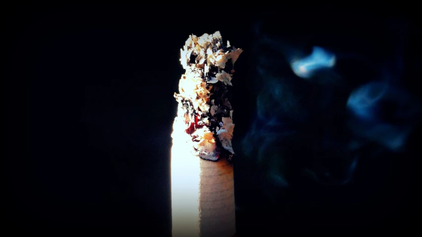 a close up of a cigarette with smoke coming out of it, a picture, inspired by William Harnett, [ shards, edited, jackstraws, torch - lit