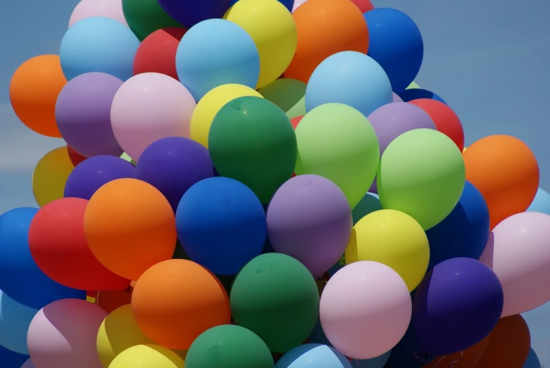 a bunch of colorful balloons floating in the air, a picture, by Steven Belledin, color field, full of colour w 1024, [ colourful, insanely inflated hips, protons